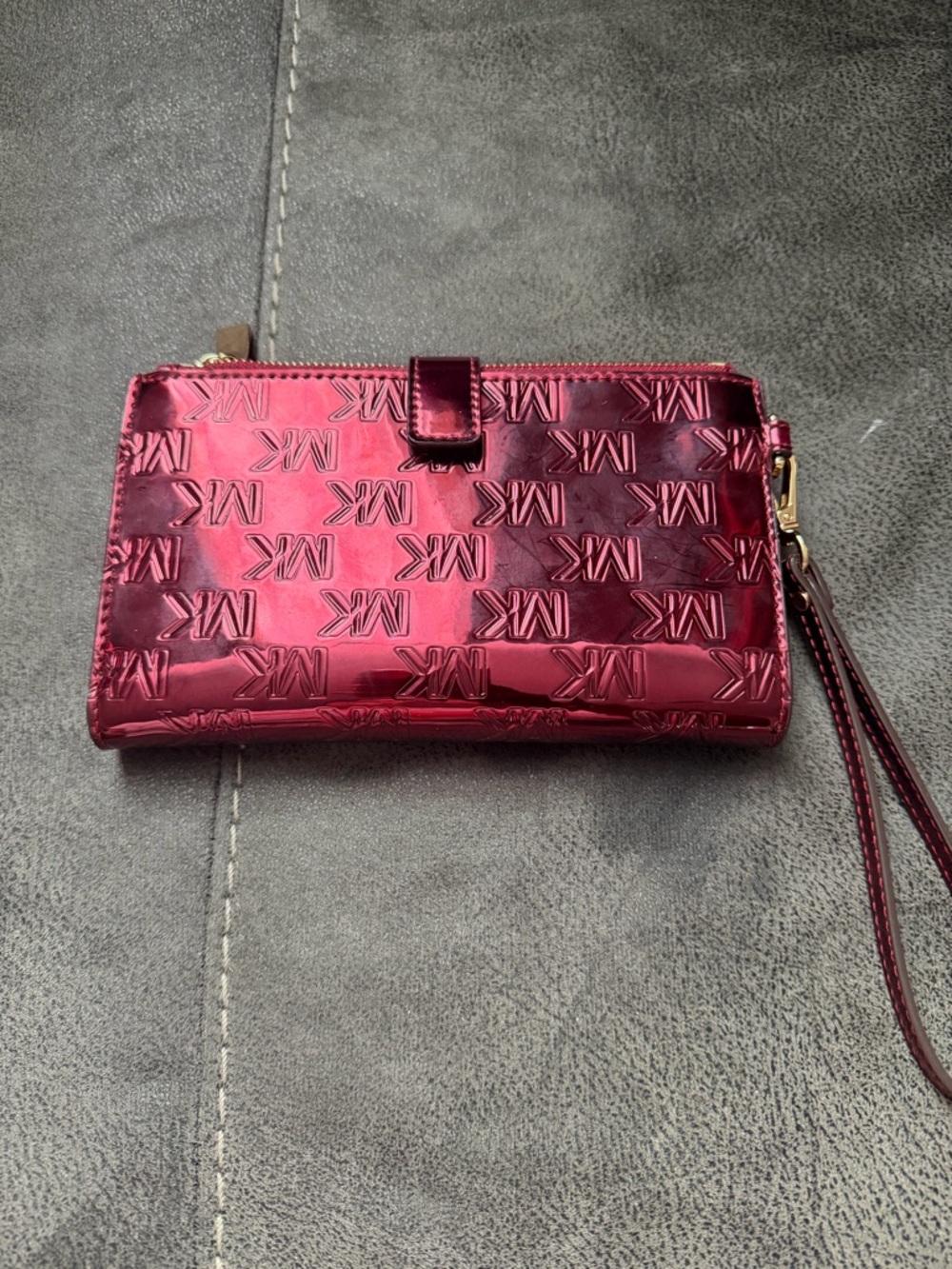 Michael Kors Metallic Fuchsia MK Embossed Wristlet - Picture 3 of 3
